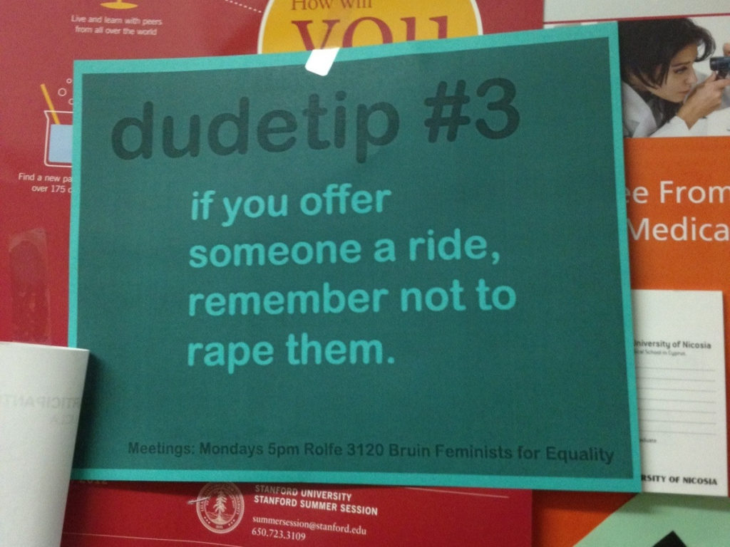 A poster that says "Dude tip: if you offer someone a ride, remember not to rape them."