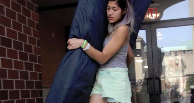 A photo of Emma Sulkowicz carrying a mattress around the campus of Columbia University.